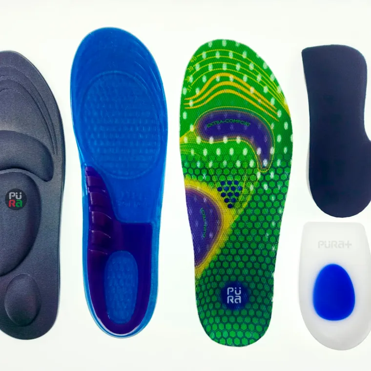 Several types of shoe insole laid out on a white background