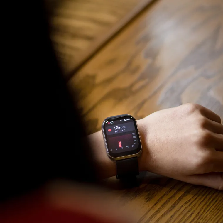 Wrist fitness tracker showing a heart rate reading, used to track heart rate variability